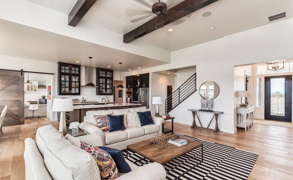 modern Farmhouse Living Room with two white sofas, a rectangular wood coffee table, a side table, a console table and a mirror in perfect modern farmhouse style