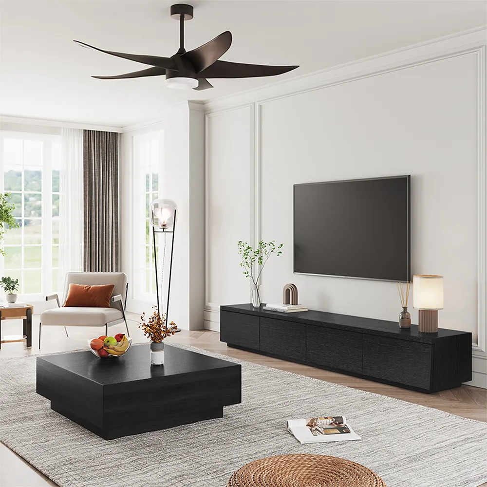 Modern living room with black TV console and coffee table, featuring neutral tones and large windows