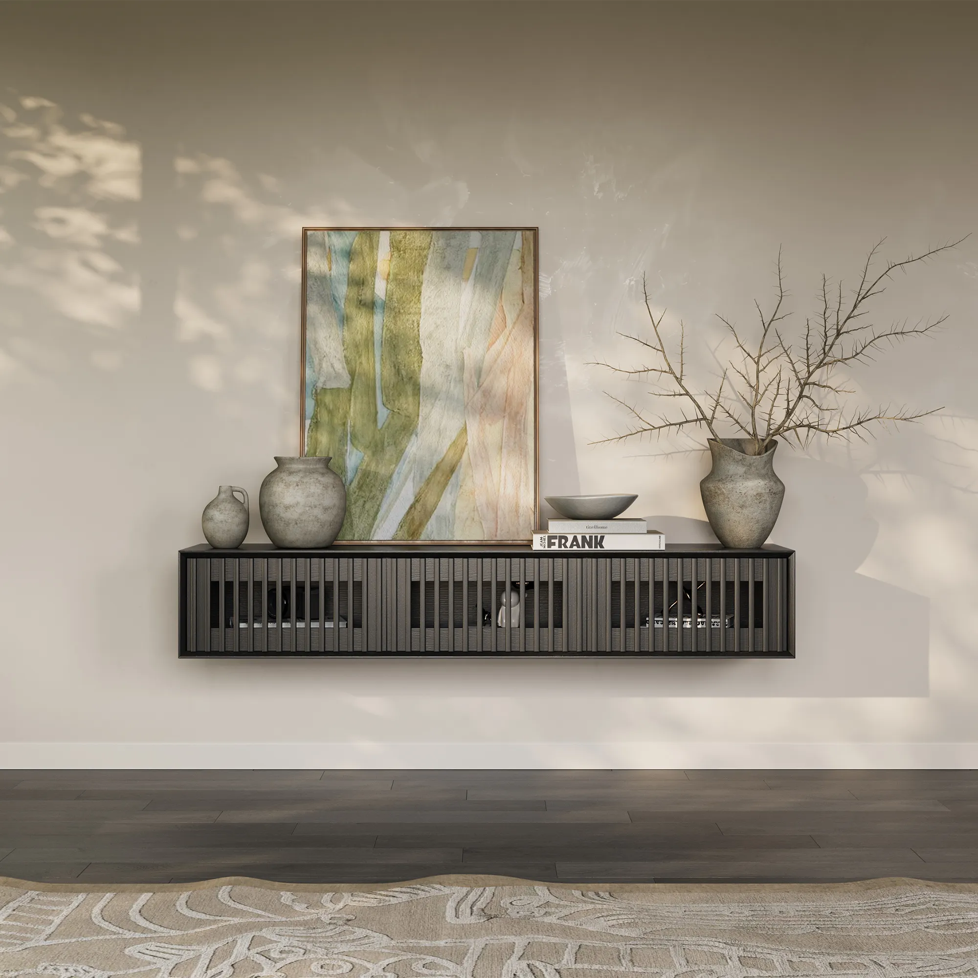 Modern black floating TV stand with slatted doors, decorated with neutral vases and abstract artwork on a beige wall