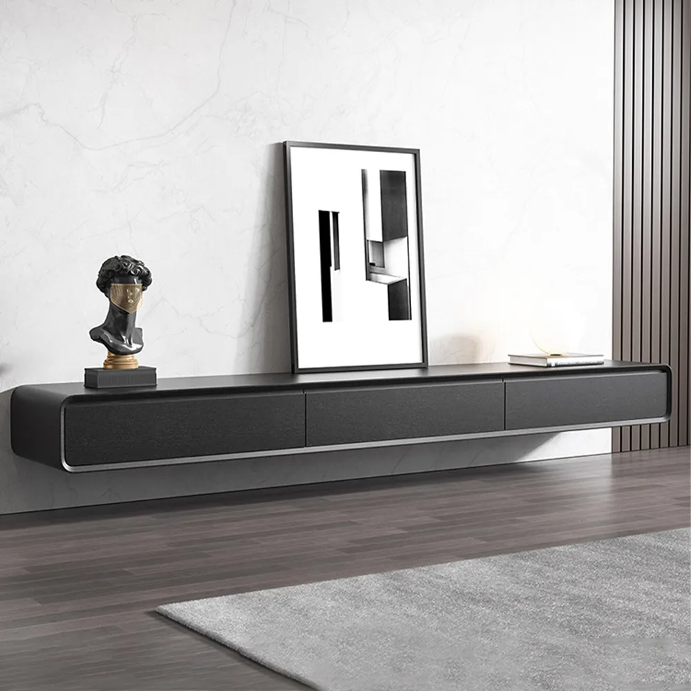 Sleek wall-mounted black TV cabinet with a modern art sculpture and framed artwork, set against a marble accent wall