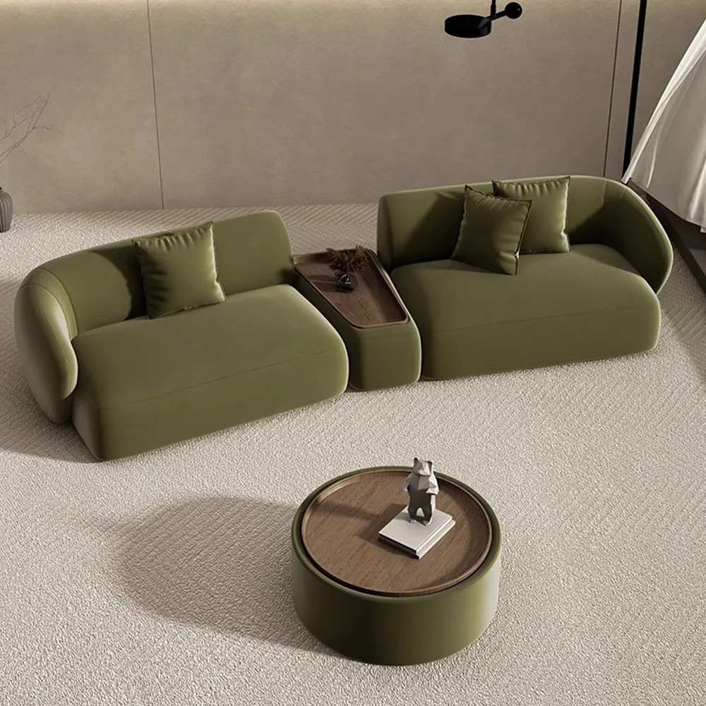 Fully assembled modular green sofa with Japandi-style curves and an integrated wood side table, paired with a round coffee table for a modern living space.