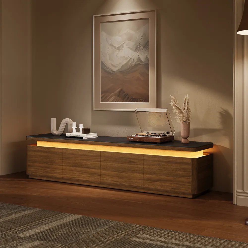 A walnut TV stand with built-in adjustable LED lighting, styled with modern decor and a vinyl record player under warm ambient light.