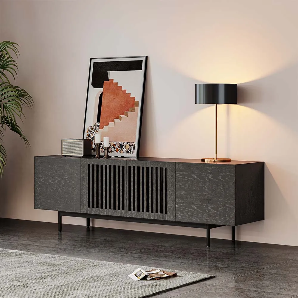 Dark oak TV console with center slatted panel and side storage, styled with modern art and lamp