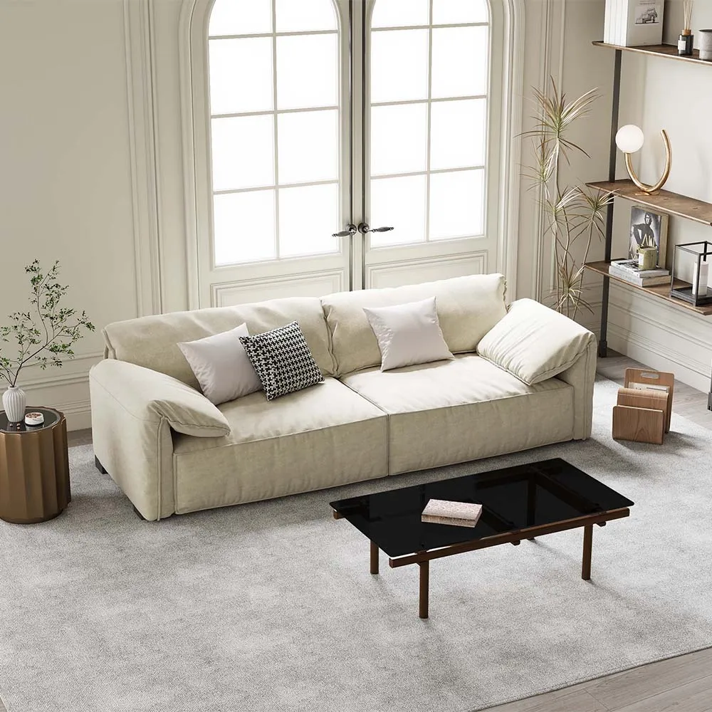 Minimalist off-white deep seat sofa in a classic living room with large French windows and modern decor