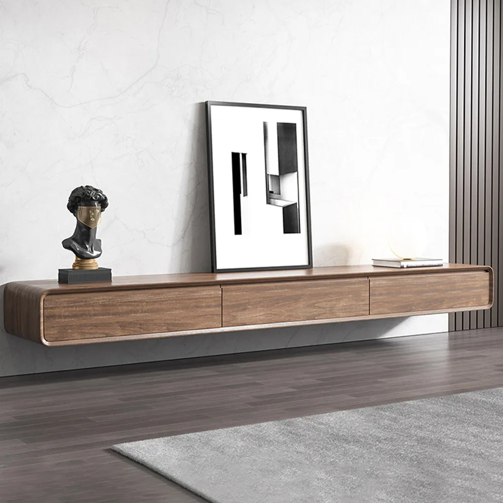 Floating walnut wood TV stand with rounded corners and minimalist decor against marble-textured wall