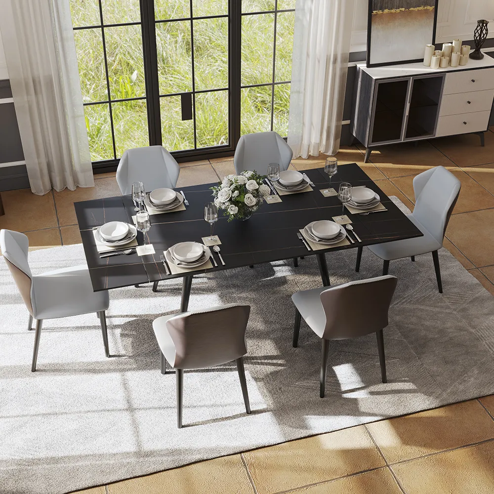 Spacious modern dining room with a rectangular black dining table set for six, surrounded by mixed-tone chairs and natural daylight.