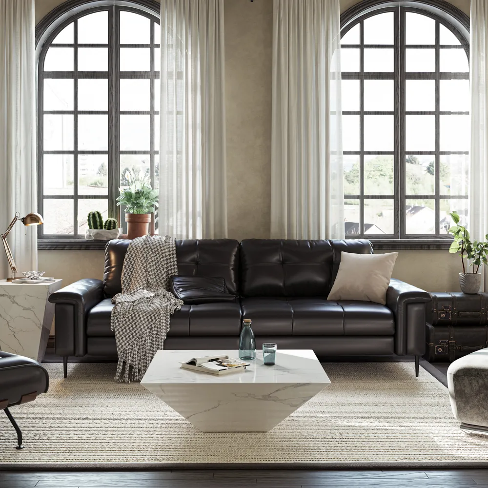 Sleek black faux leather sofa set against large arched windows, paired with a geometric marble coffee table and layered area rug in a contemporary setting.