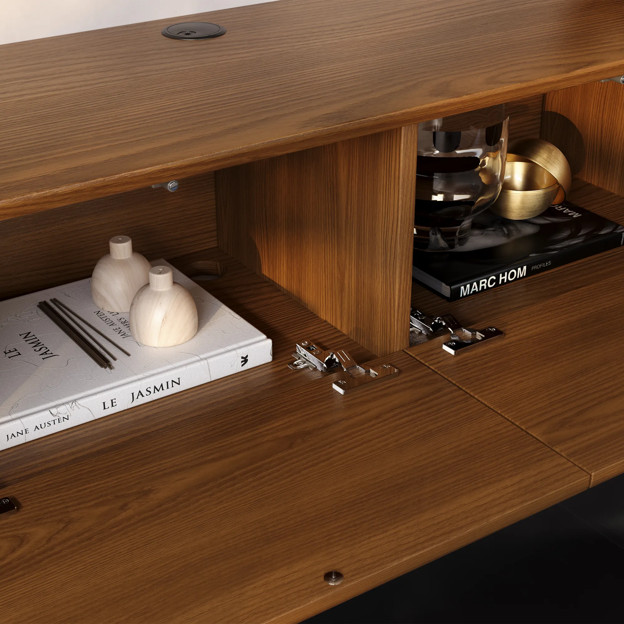 Close-up of a wooden TV console interior featuring organized shelves with books and decorative accessories.