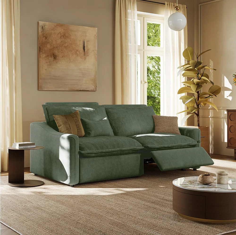 Olive green modular reclining loveseat in a cozy beige-toned living room with abstract wall art and soft natural light