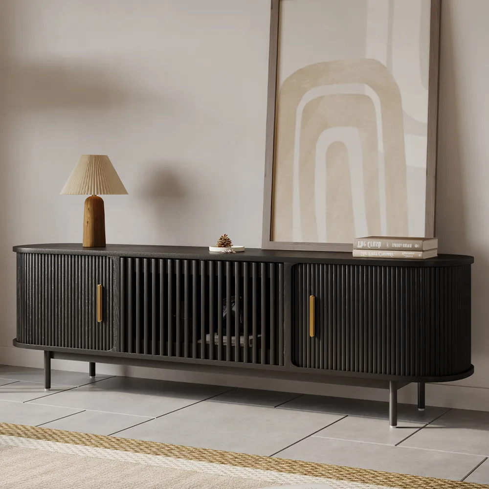 Modern black slatted wood TV stand with brass handles for contemporary living room decor