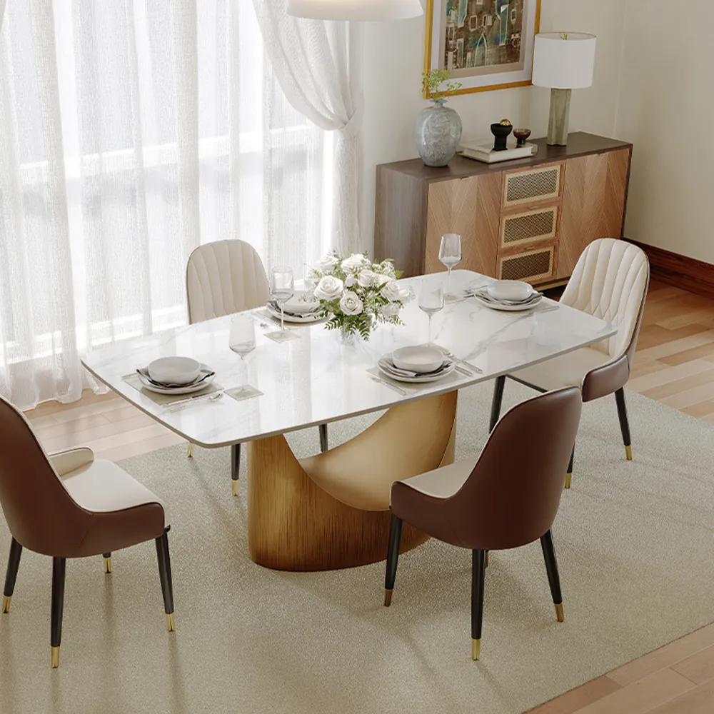 Rectangular sintered stone dining table with sculptural base in elegant modern dining area