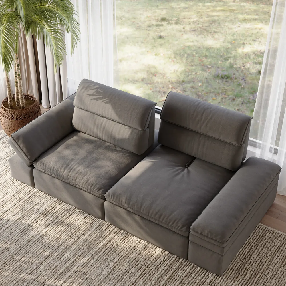 Modern gray power recliner sofa with adjustable headrests, placed in a bright living room with floor-to-ceiling windows and a round wooden coffee table.