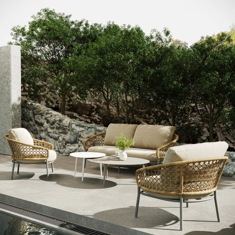 5-piece outdoor wicker sofa set with beige cushions and round coffee tables by a poolside garden