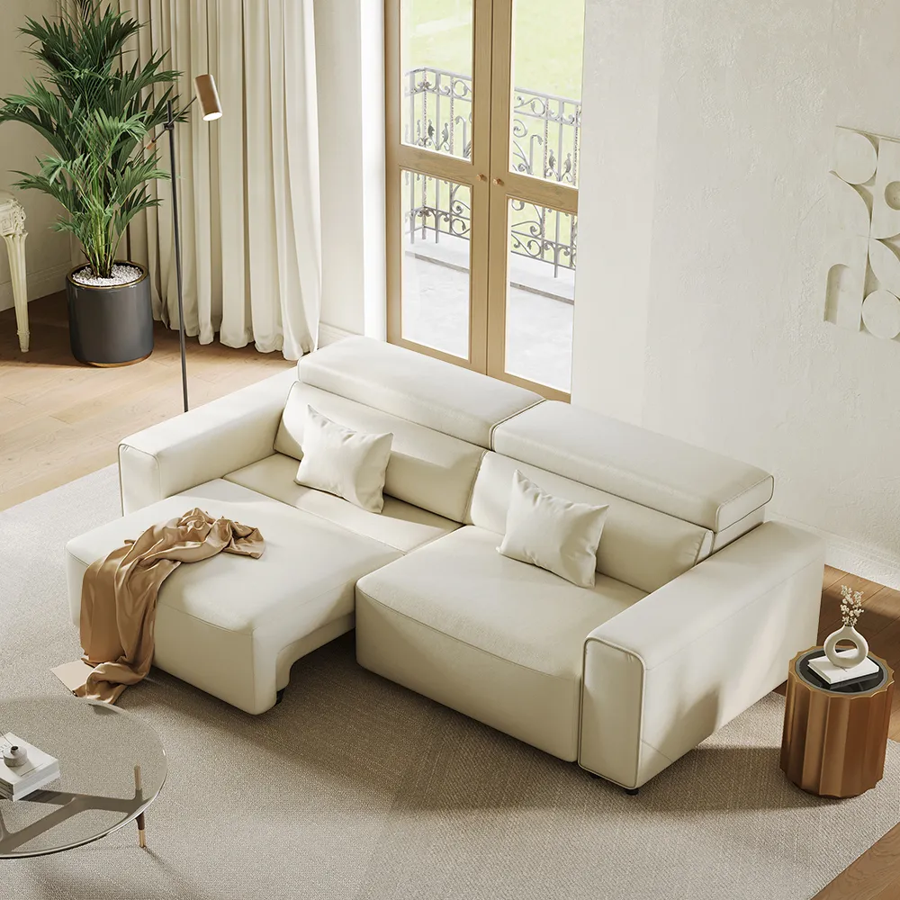 Cream modular sofa in a sunlit living room with neutral tones and a glass coffee table.