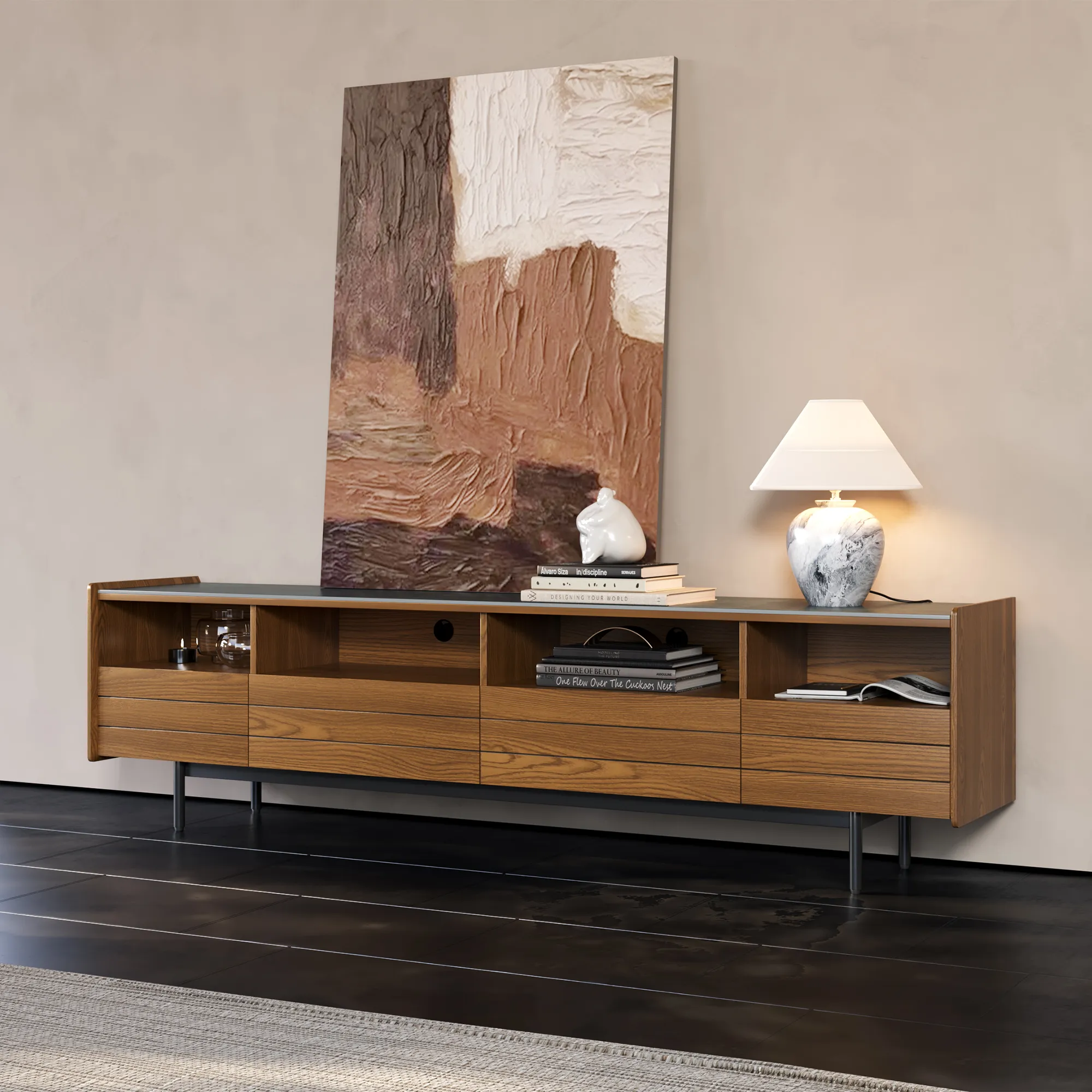 Modern wood TV stand with open shelving and drawers, styled with books, abstract wall art, and a marble table lamp in a minimalist living room