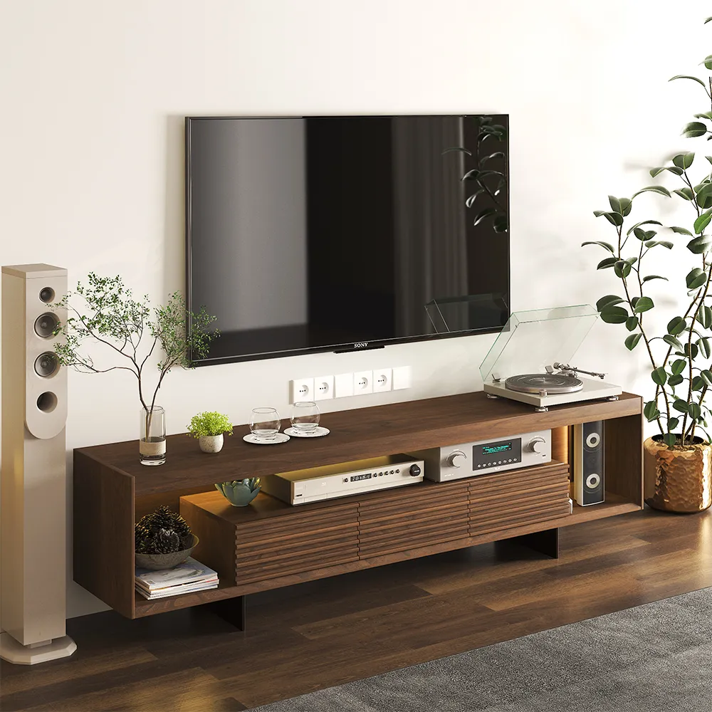 Mid-century modern wood TV stand styled with record player, audio equipment, and plants, placed under a wall-mounted TV in a cozy entertainment space.