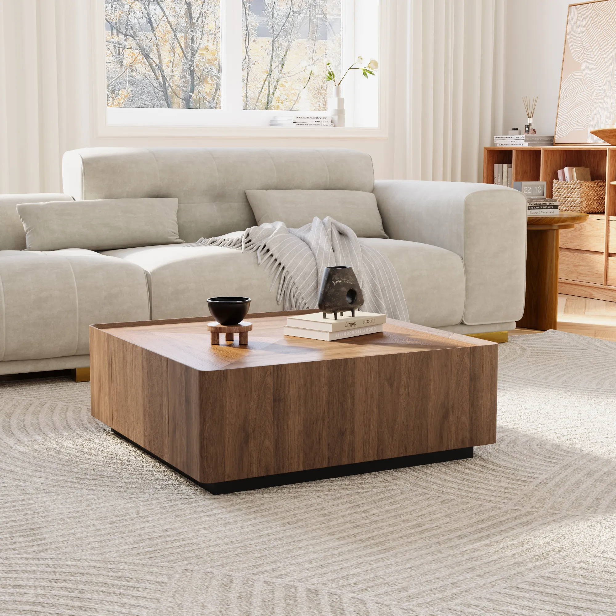 Contemporary living room with a square walnut coffee table and light gray sofa, set on a textured rug with neutral-toned accents.