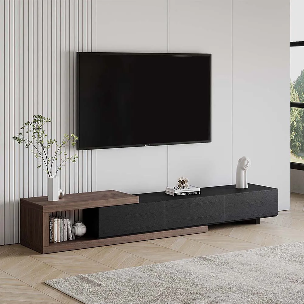 Contemporary low-profile TV stand in black and walnut tones with open shelving and modern decor, placed under a wall-mounted flat screen in a minimalist living room.
