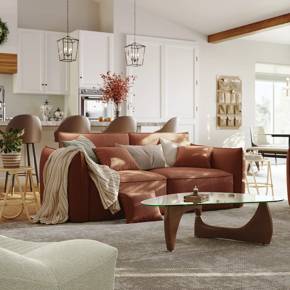 Deep sleeper-style cloud sectional sofa in pet-friendly taupe fabric with adjustable back cushions and solid wood legs, styled in a warm open-concept living space.