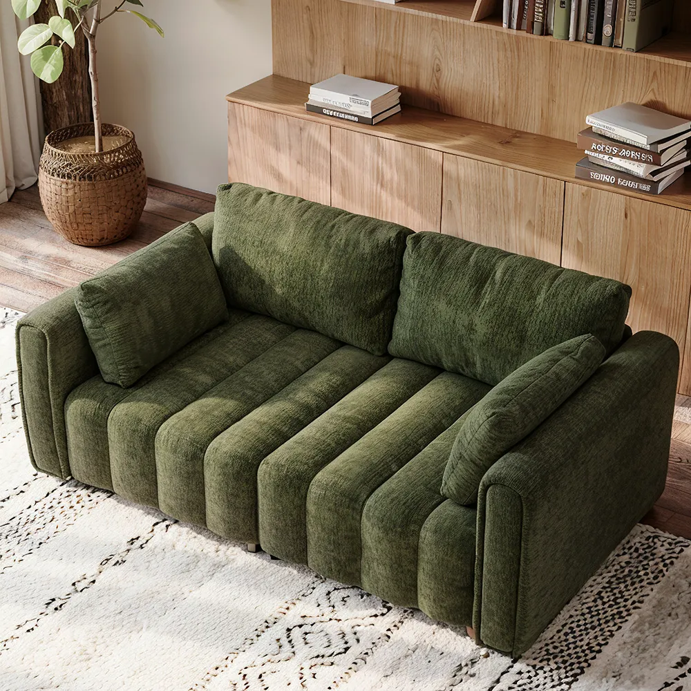 Top view of retro-style green chenille sofa with tufted seating in a modern wood-accented living room