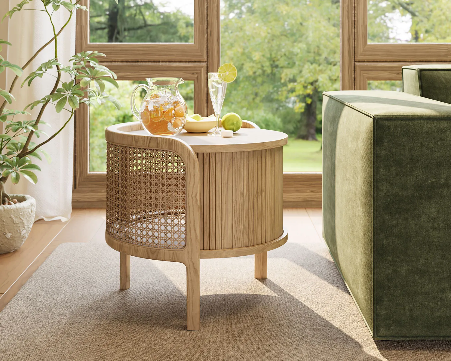 Round cane-and-wood side table by a window with lemonade and summer fruit in a bright interior.
