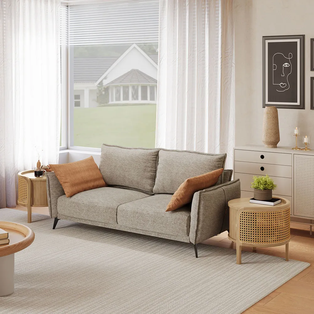 Cozy living room with a fully assembled light beige loveseat sofa, rattan side tables, and neutral-toned decor, perfect for modern apartment styling.