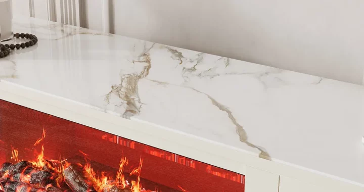 Close-up of a white sintered stone TV stand top with realistic electric fireplace flame and glowing logs