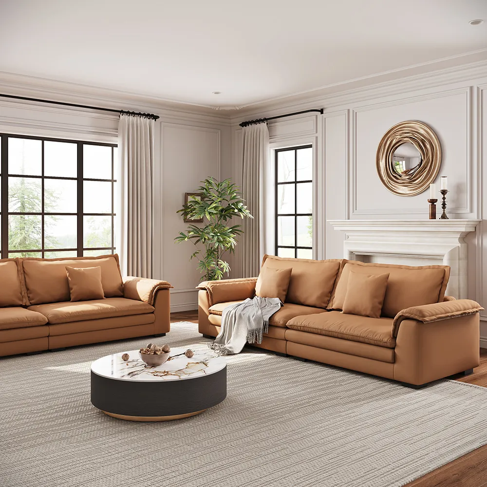 Light-filled living room with tan leather sofas, round marble coffee table, and modern classic decor by Povison