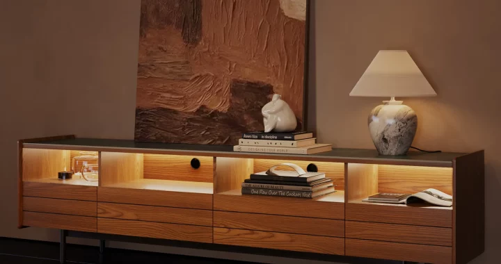 Wooden TV stand with open shelving and warm ambient LED lighting, ideal for cozy living rooms with evening ambiance