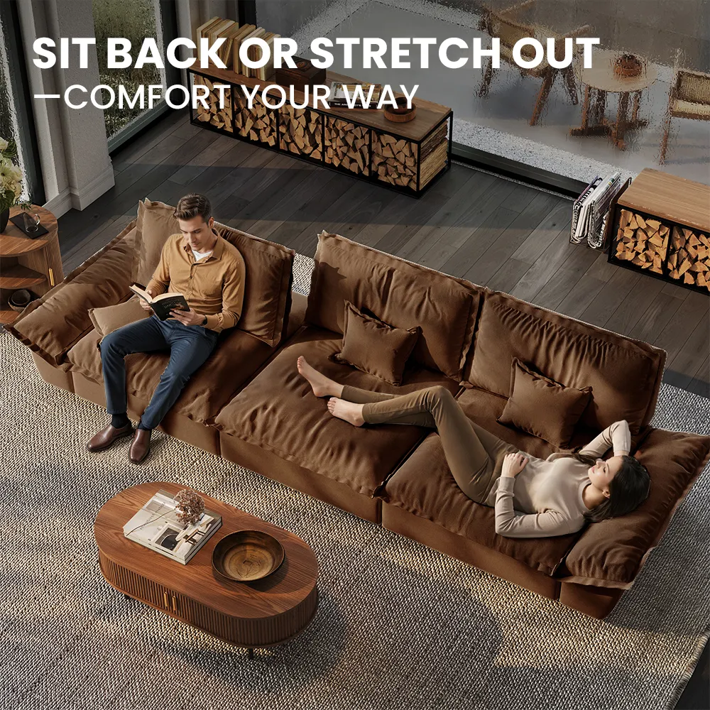 Oversized brown modular sofa with lounge cushions, shown with a man reading and woman reclining in a cozy modern living room