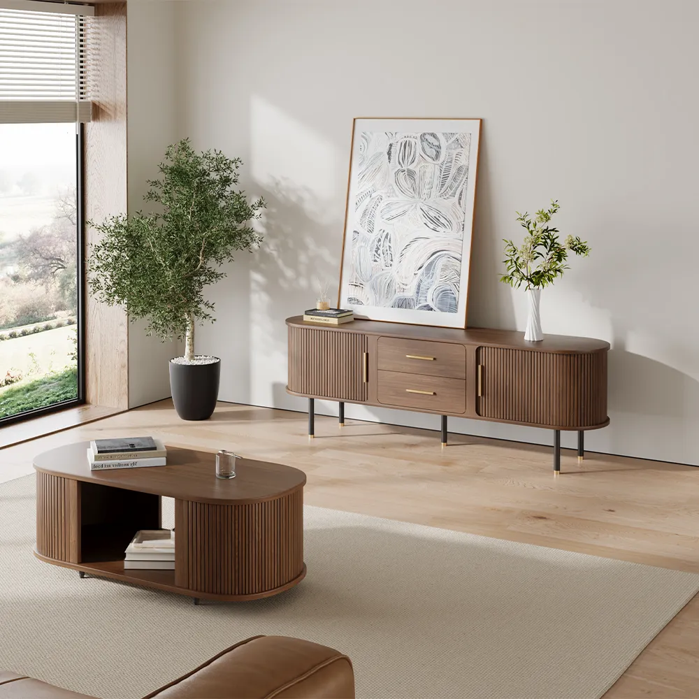 Modern living room featuring a fully assembled walnut TV stand with brass handles and matching oval coffee table, styled with minimalist decor and natural light.