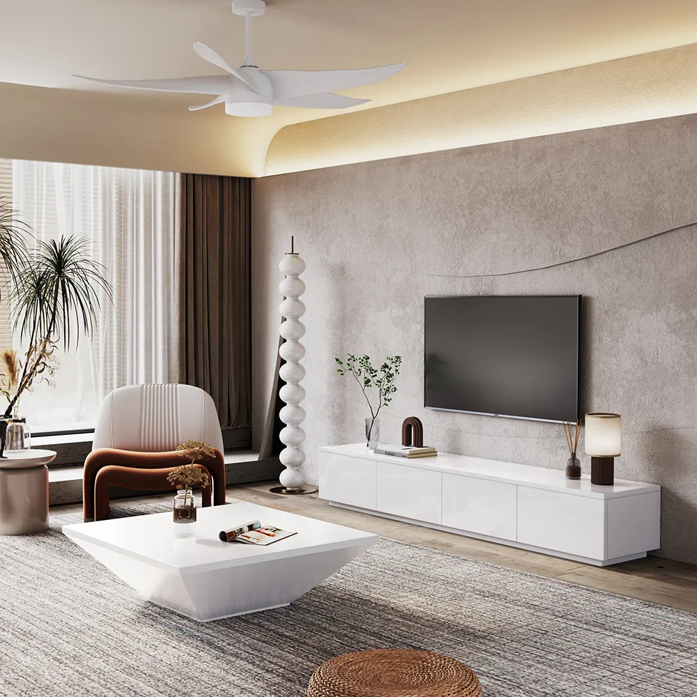 Contemporary living room with white TV console, sculptural coffee table, and accent chair, featuring soft neutral tones and layered textures