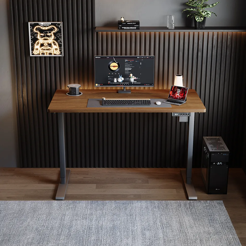 Height-adjustable electric standing desk with woodgrain top, digital panel, and organized workstation setup