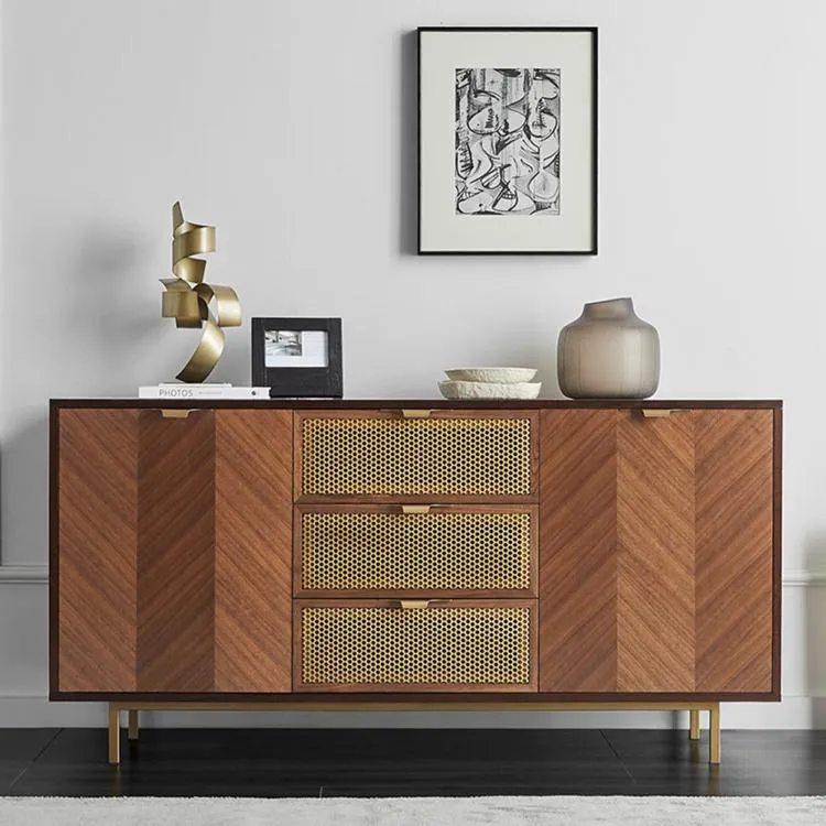 Dark herringbone mid-century sideboard with rattan drawers, styled for fall decor
