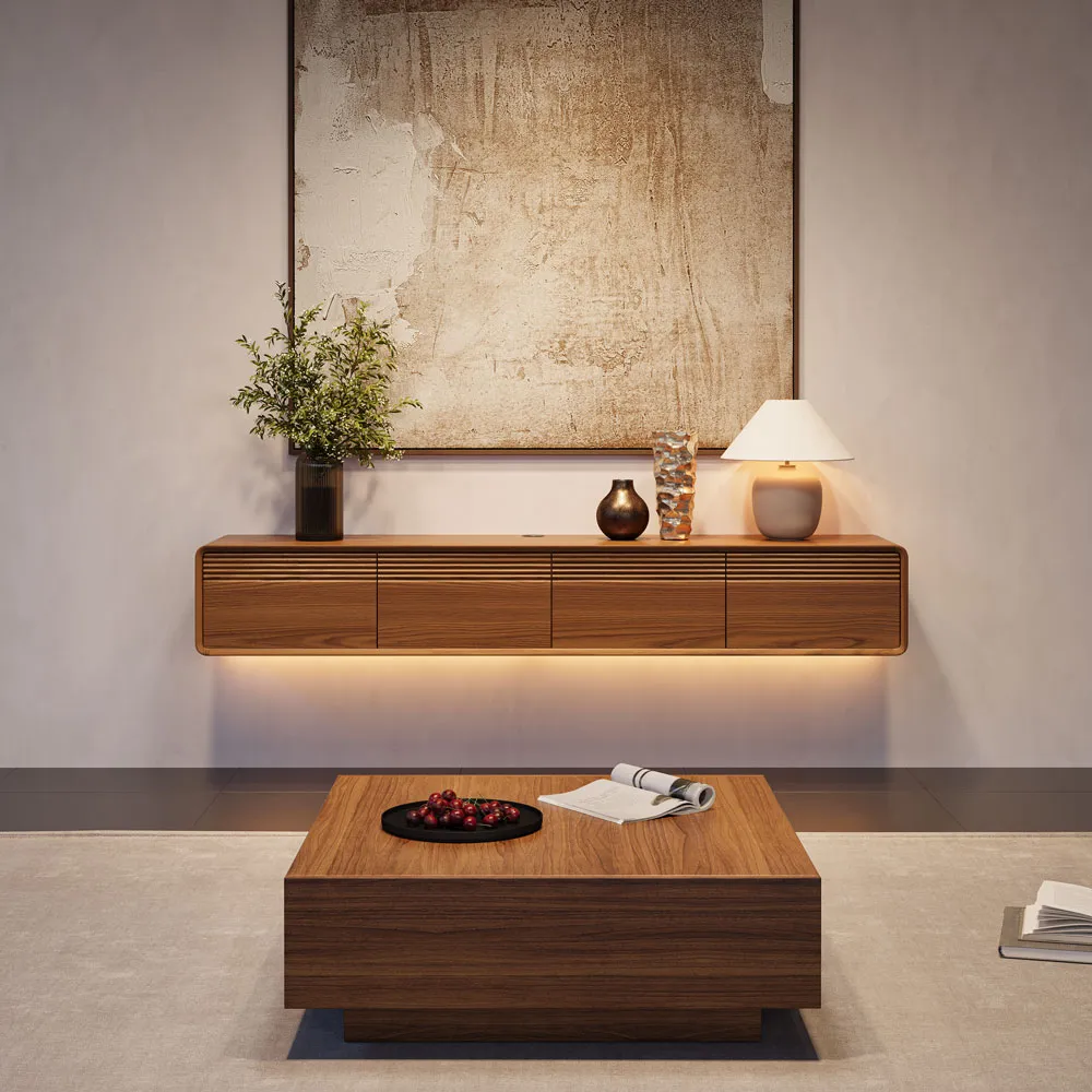 Floating walnut TV stand with warm LED lighting and matching coffee table in a cozy minimalist living room