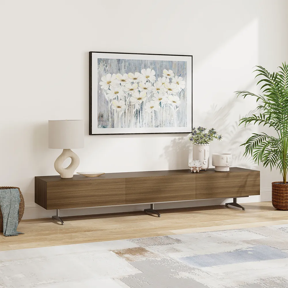 Minimalist mid-century modern TV stand in walnut finish beneath floral artwork with modern decor styling