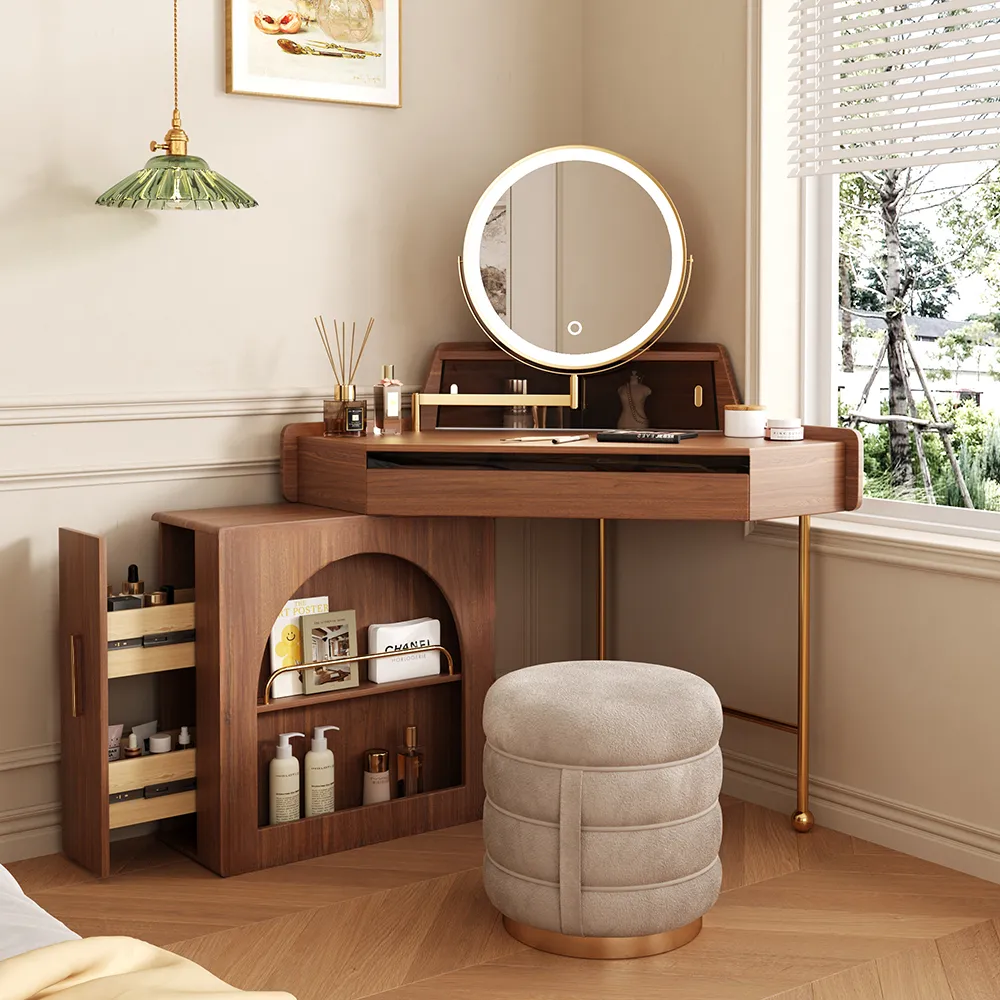  Elegant corner vanity table with built-in round LED mirror, open shelves, and a plush stool in a sunlit bedroom corner