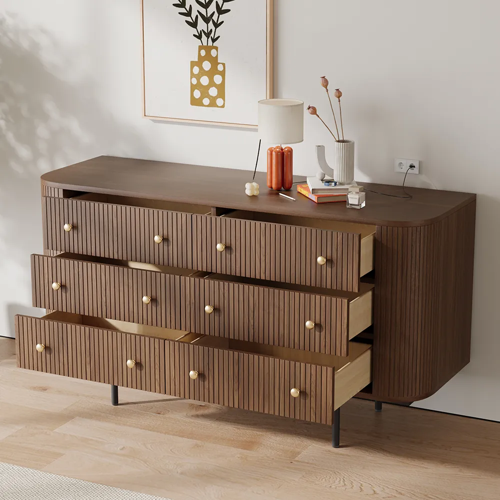 A classic mid-century modern dresser made of walnut wood, with tapered legs and simple hardware, in a well-organized bedroom.