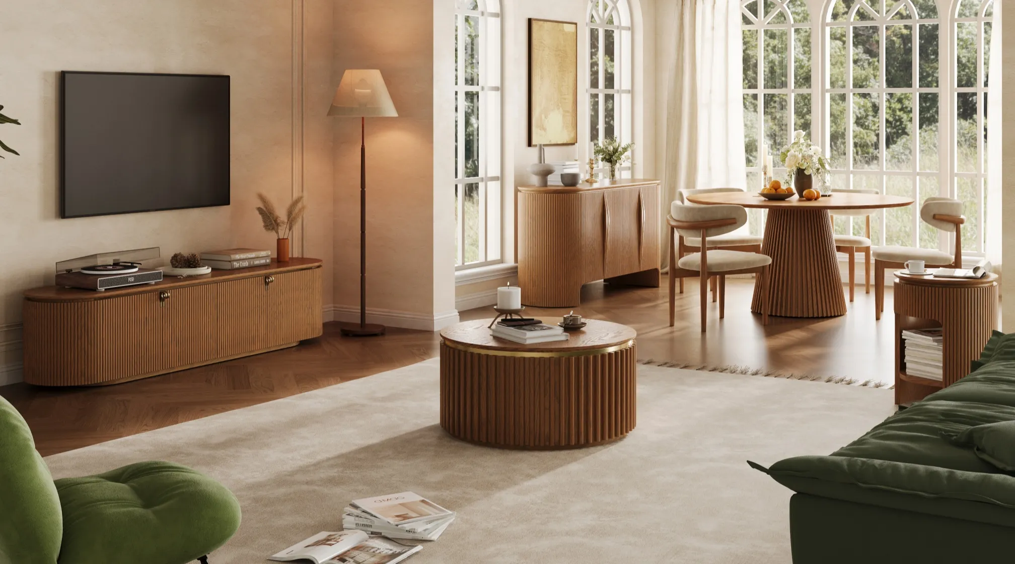 Open-concept living and dining space styled with mid-century modern furniture, featuring a fluted wood TV stand, round coffee table, sculpted sideboard, and pedestal-base dining table in a sunlit interior.