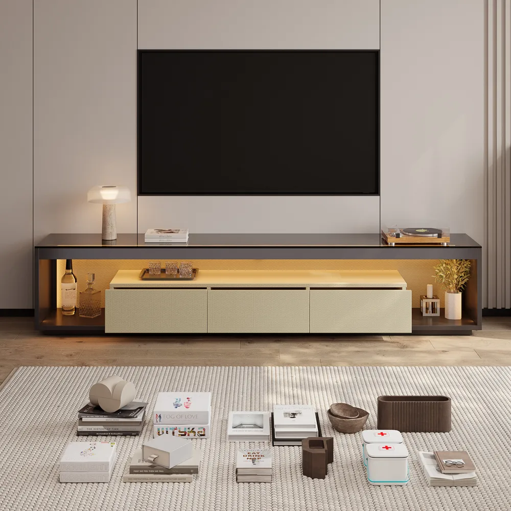 Modern TV console with glass top and warm under-cabinet lighting, styled with a table lamp, books, vinyl record player, and minimalist decor.