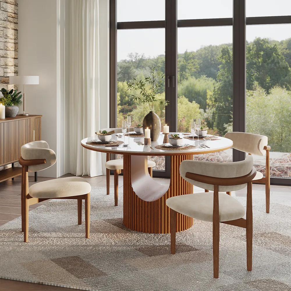 Contemporary mid-century modern dining set featuring a sculptural walnut base and marble top, placed in a nature-inspired room with floor-to-ceiling windows.