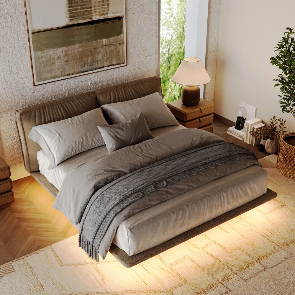 Modern queen bed with illuminated base and textured throw pillows in a night-time bedroom setting with warm lighting