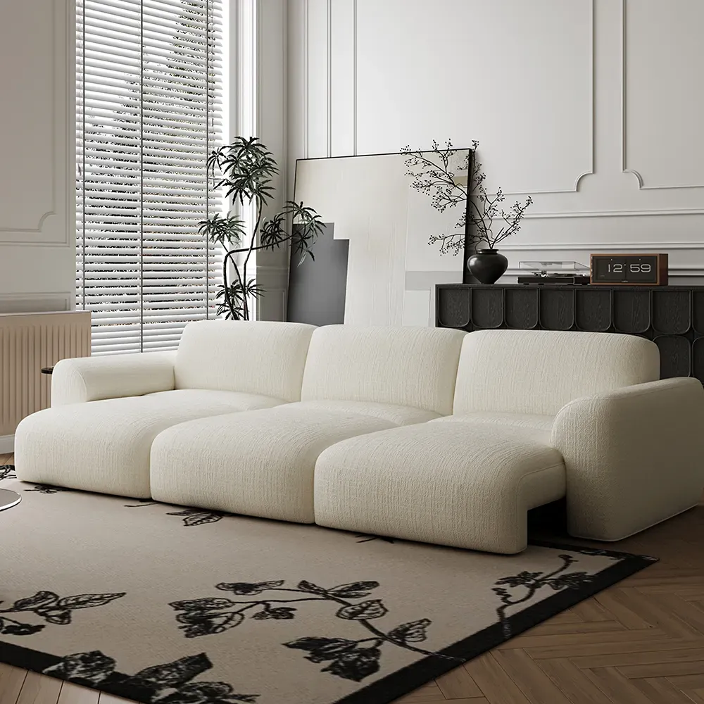 White three-seat POVISON Aurora power sofa bed with rounded arms in a bright modern living room.