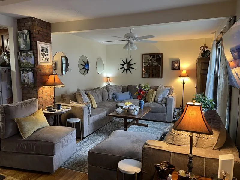 Cozy Living Room Featuring The Most Comfortable Sectional Sofa With Chaise In Soft Gray Fabric