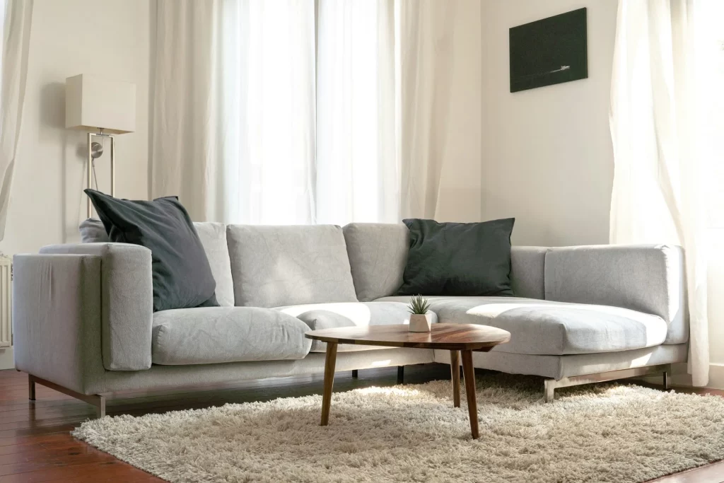 Grey Sofa Living Room Ideas Featuring a Light Grey Sectional Against Off-White Walls