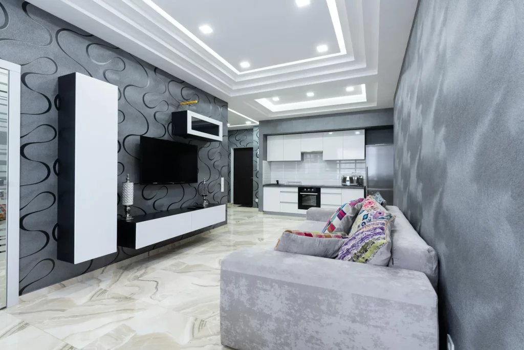 Grey Sofa Living Room Ideas Featuring a Velvet Grey Sofa, Black-and-White Modern Cabinetry, and Marble Floors