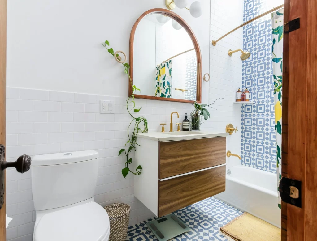 Mid Century Modern Bathroom Ideas Featuring Bold Blue Geometric Tiles, Brass Hardwares, and Wooden Vanity