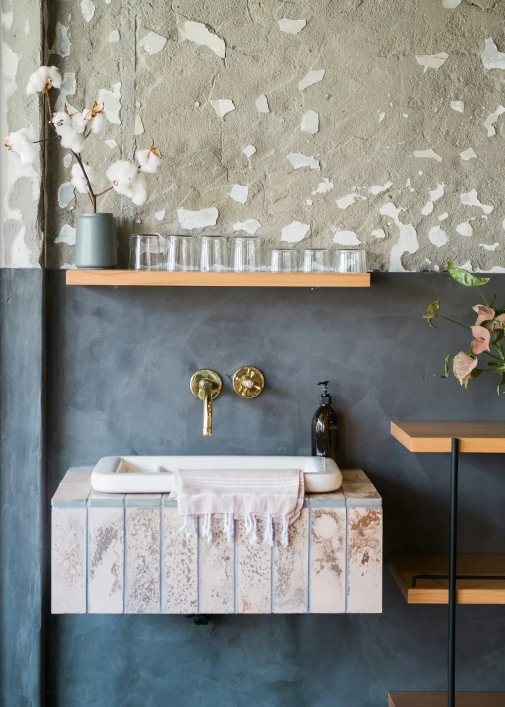 Mid Century Modern Bathroom Ideas Featuring Concrete Textures, Brass Fixtures, and a Small Floating Vanity