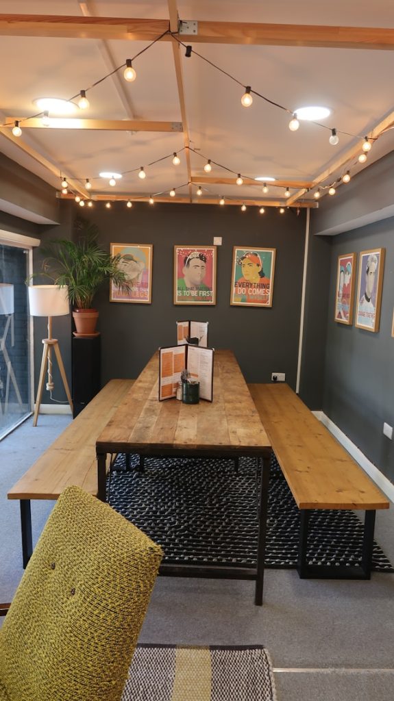 A cozy dining room with a long table