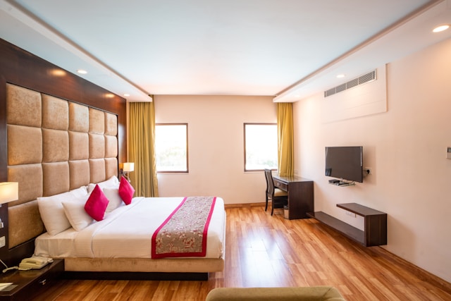 A modern bedroom with a comfortable king bed